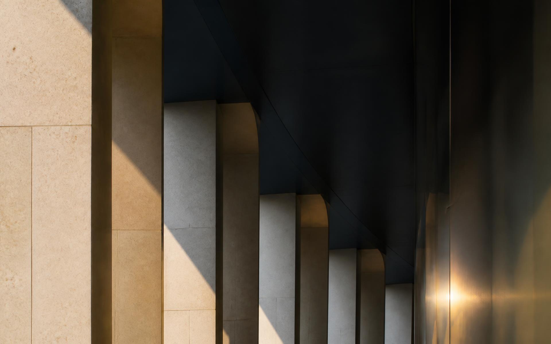 Limestone colonnade in late afternoon light